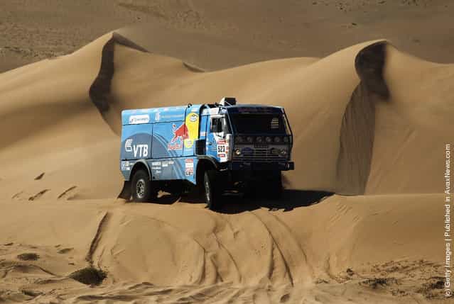 Ilgizar Mardeev of Russia drives his Kamaz truck over a sand dune during stage seven of the 2012 Dakar Rally