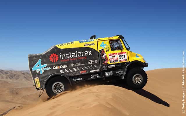 Alex Loprais of the Czech Republic drives his Tatra truck over a sand dune during stage seven of the 2012 Dakar Rally