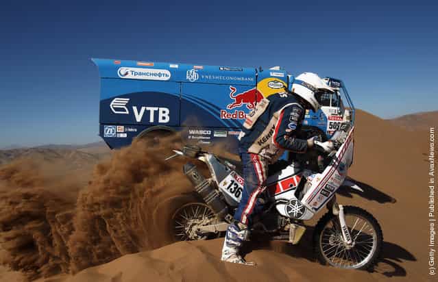 Gintautas Igaris of Lithuania and Franco Picco Racing rides up a sand dune during stage seven of the 2012 Dakar Rally