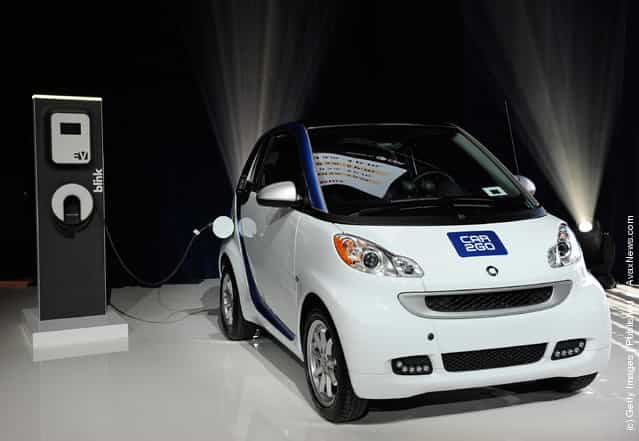 An electric car2go Smart vehicle from the companys carsharing network is displayed before a keynote address by Chairman of the Board of Management of Daimler AG and head of Mercedes-Benz Cars Dr. Dieter Zetsche at the 2012 International Consumer Electronics Show