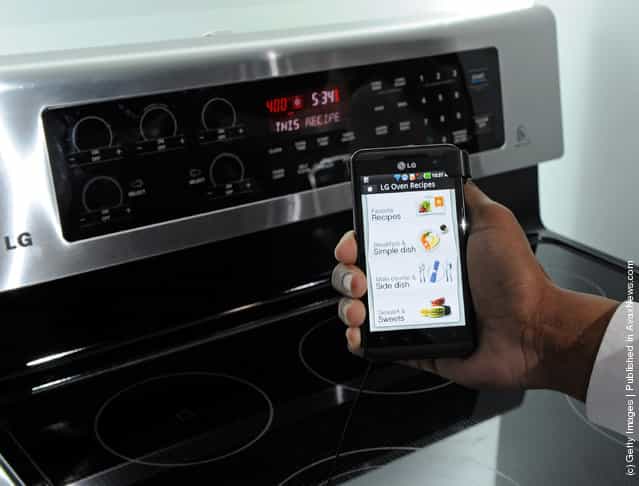 A smartphone sending instructions to an oven using LGs newest Smart ThinQ technology is demonstrated at the LG Electronics booth at the 2012 International Consumer Electronics Show