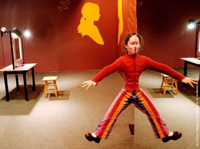 Hannah Pasternak, a student at Smith Elementary School in Tenafly, New Jersey appears to hover in space by using a combination of mirrors January 29, 2004 at The American Museum of Natural History in New York City