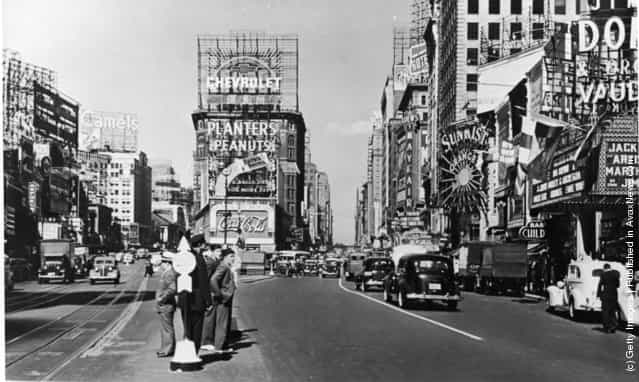 A view of Times Square at the intersection of Broadway and 7th Avenue, New York City, New York, 1937