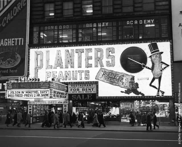 A view of the Embassy Theater and Planters Peanut Sign in Times Square, New York City, New York, 1941