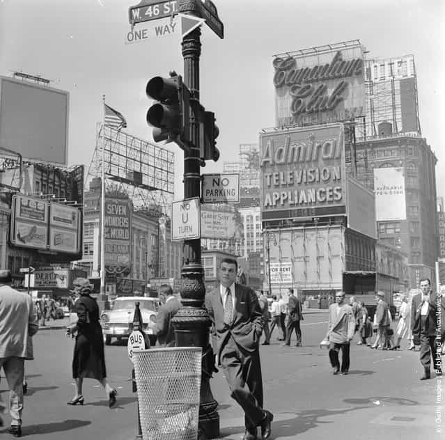 A salesman bides his time in Times Square, Manhattan, New York, 1950