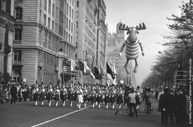 1961: Americans celebrate Thanksgiving Day in New York. The parade nears Times Square