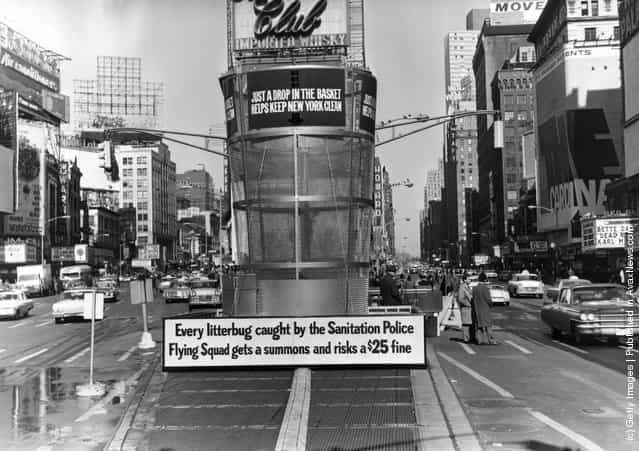 1964: A gigantic litter basket in Times Square, New York with a sign saying, Just a Drop in the basket keeps new York Clean