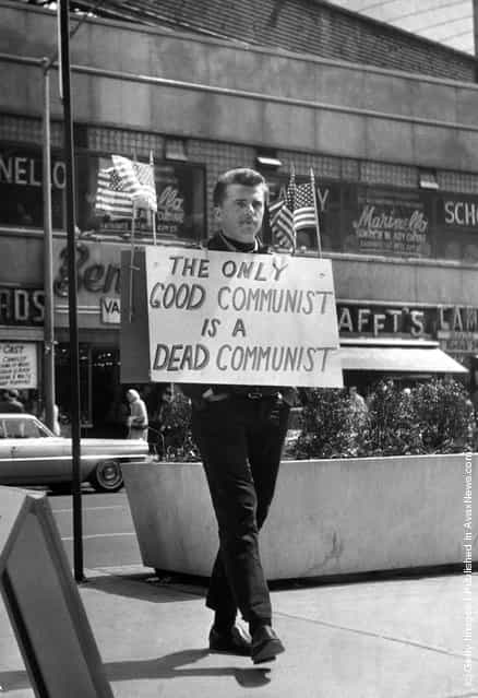 1965: New York nightclub owner Jack L Hickman spends his free time marching around Times Square with a sign that reads The only good communist is a dead communist