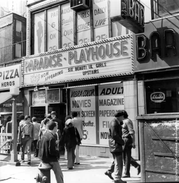 1975: A porn shop with films and live shows near Times Square, New York