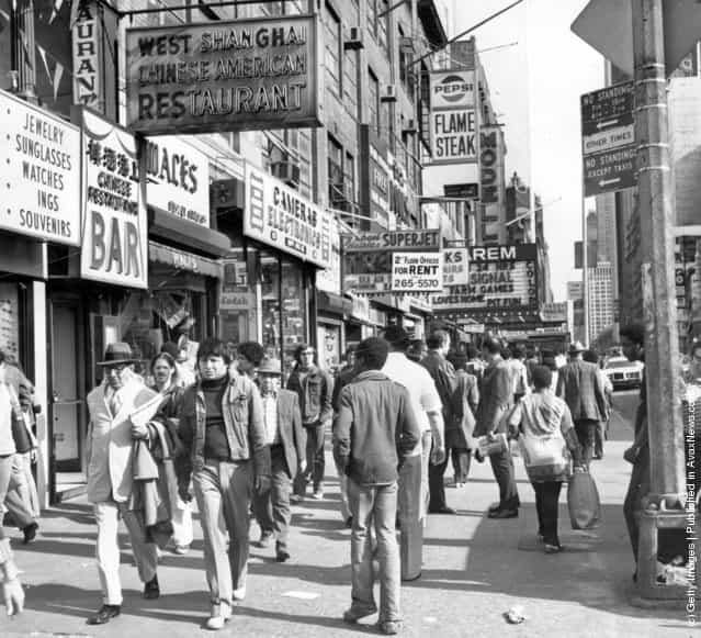 1975: Shoppers on West 42nd Street between 7th and 8th Avenues in the Times Square area of New York