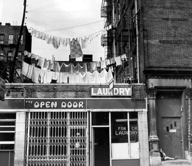 1977: Clean washing hanging out to dry above a laundry one block west of the more glamorous Times Square, New York