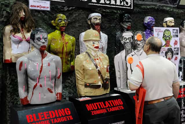 Shooting targets are displayed at the Zombie Industries booth