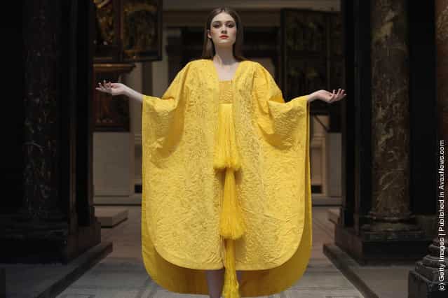 Model Bianca Gavrilas wears a a hand-embroidered cape made from the silk of the Golden Orb Spider in the V&A Museums Medieval and Renaissance Gallery