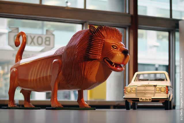 Coffins in the shape of a Lion and a car