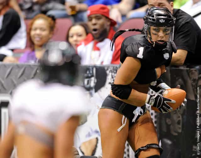Audrey Latsko #1 of the Los Angeles Temptation runs for yardage against the Philadelphia Passion during the Lingerie Football Leagues Lingerie Bowl IX at the Orleans Arena