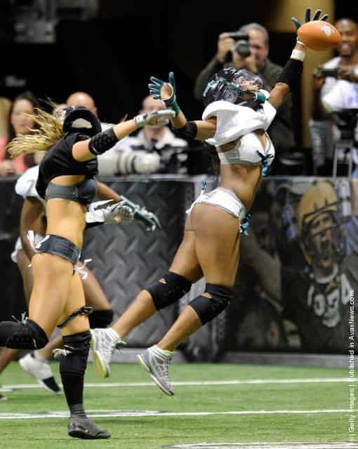Jaleesa McCrary #14 of the Philadelphia Passion cant pull down a pass against the Los Angeles Temptation during the Lingerie Football Leagues Lingerie Bowl IX at the Orleans Arena