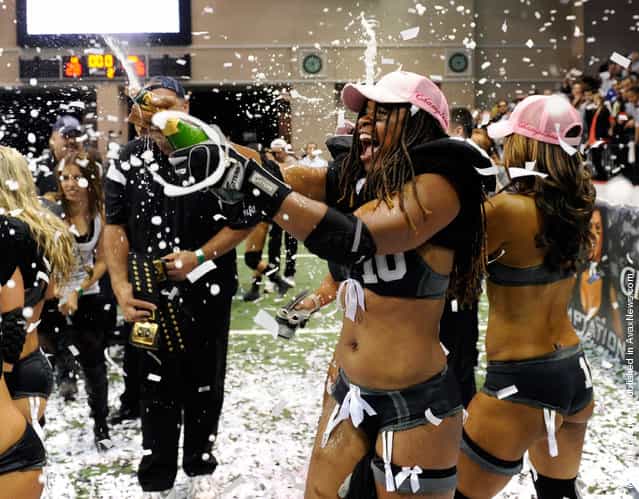 Amber Reed #10 of the Los Angeles Temptation celebrates her teams 28-6 victory over the Philadelphia Passion to win the Lingerie Football Leagues Lingerie Bowl IX at the Orleans Arena