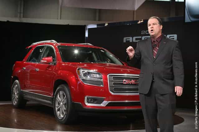 Tony DiSalle, U.S. Marketing Vice President at GMC, introduces the 2013 Acadia during the media preview of the Chicago Auto Show