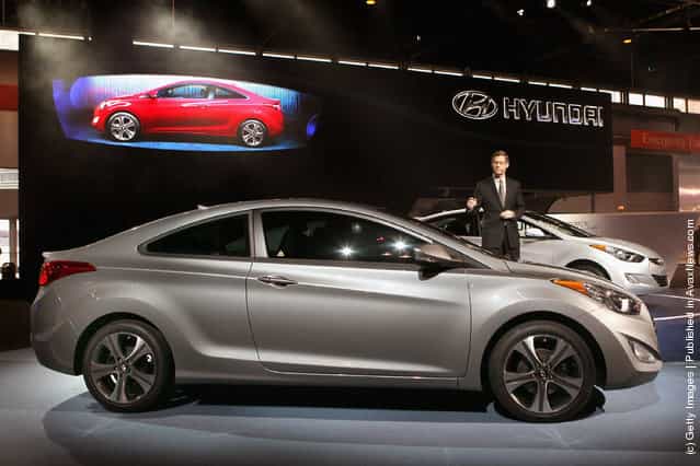 Mike OBrien, vice president of product and corporate planning at Hyundai, introduces the 2013 Hyundai Elantra Coupe during the media preview of the Chicago Auto Show