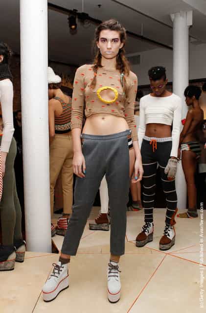 A model poses at the Degen Fall 2012 presentation during Mercedes-Benz Fashion Week