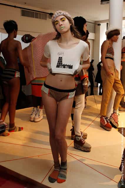 A model poses at the Degen Fall 2012 presentation during Mercedes-Benz Fashion Week