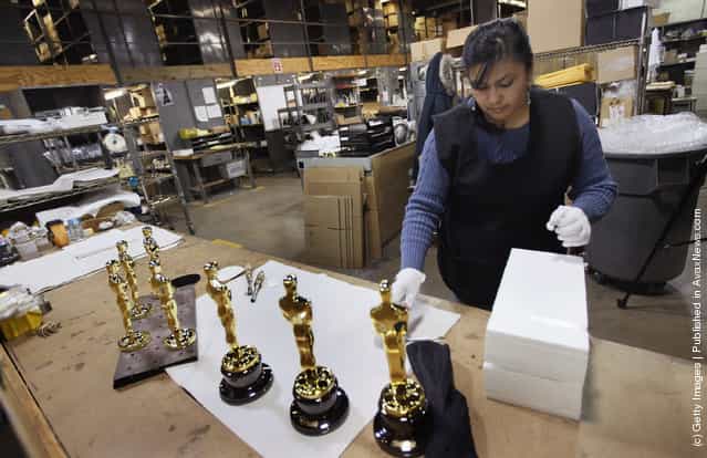 Josefina Govea packages an Oscar statuette at R.S. Owens & Company