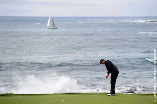 Tiger Woods putts on the ninth green during the third round of the AT&T Pebble Beach National Pro-Am at Pebble Beach Golf Links