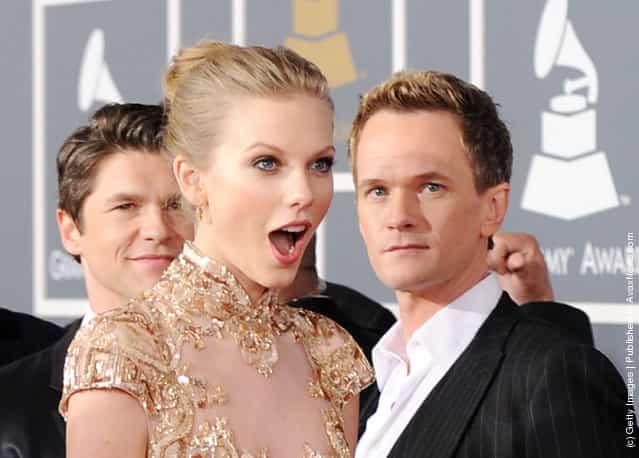 Singer Taylor Swift (L) and actor Neil Patrick Harris arrive at the 54th Annual GRAMMY Awards held at Staples Center