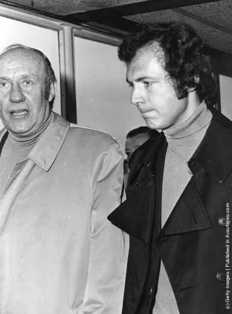 1975: Franz Beckenbauer West German football player, coach and manager arriving at Heathrow airport with Helmut Schoen