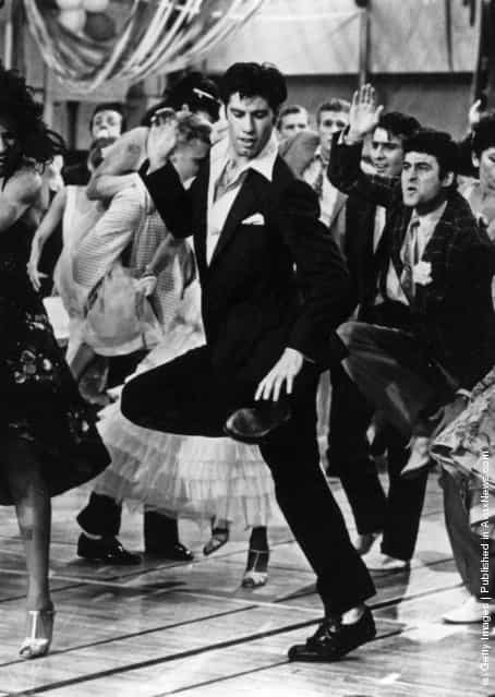 1978: Singing and dancing, actor John Travolta struts his stuff in the hit musical film Grease, a romantic comedy set in the 1950s rock n roll era, in which Travolta stars with Olivia Newton-John