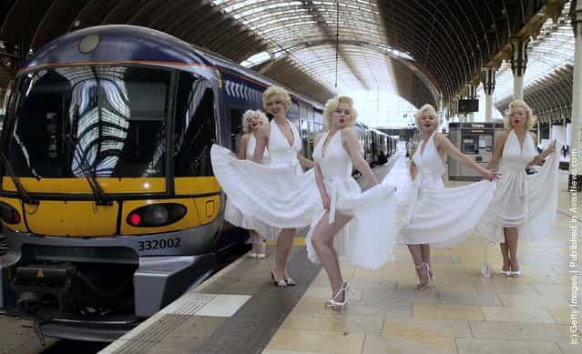 Five Marilyn Monroe look-alikes participate in the Heathrow Express Fifth birthday celebrations at Paddington Station on June 23, 2003 in London