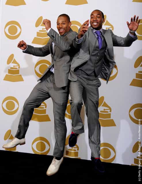 (L-R) NFL players Victor Cruz and Mario Manningham of the New York Giants pose in the press room at the 54th Annual GRAMMY Awards