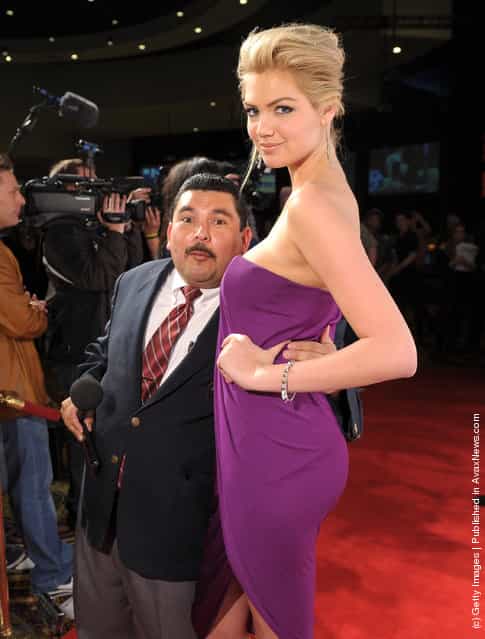 Guillermo Rodriguez and Sports Illustrated Swimsuit Issue cover model Kate Upton arrive at Club SI Swimsuit