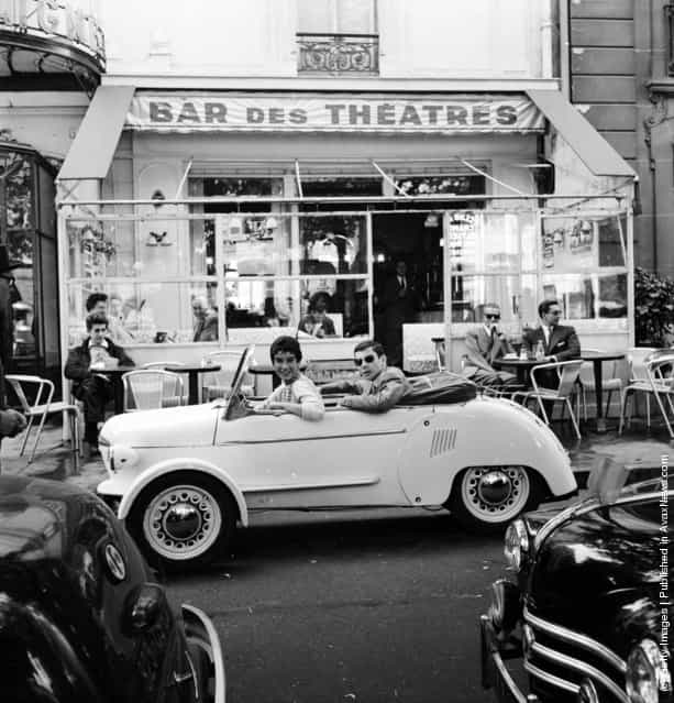 1955: French model Suzette Clairy takes her boyfriend for a spin in a Reyonnah, a narrow runabout vehicle named after its inventor, Monsieur Hannoyer. The front wheels can be drawn in to enable the car to pass into a tight parking space, or even through a doorway