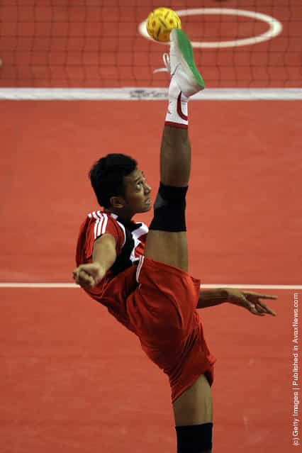 Sepaktakraw: E.P. Victoria of Indonesia competes against Japan during day one of the ISTAF Super Series at Palembang Sport Convention Center