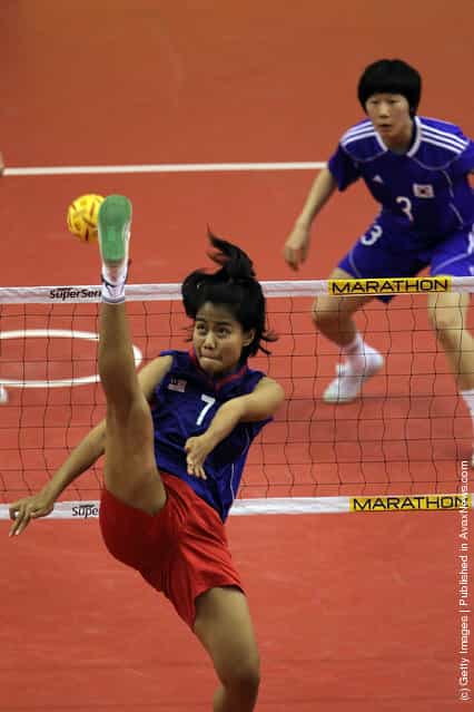 Sepaktakraw: Malaysias Noor Farhana Binti Ismail competes against South Korea during day one of the ISTAF Super Series at Palembang Sport Convention Center