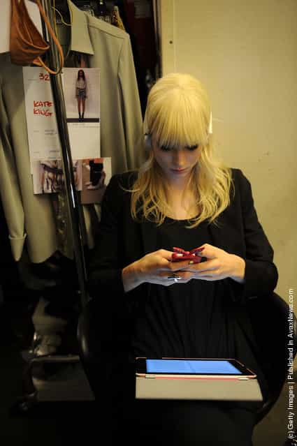 A model relaxes backstage at the Iceberg Autumn/Winter 2012/2013 fashion show as part of Milan Womenswear Fashion Week
