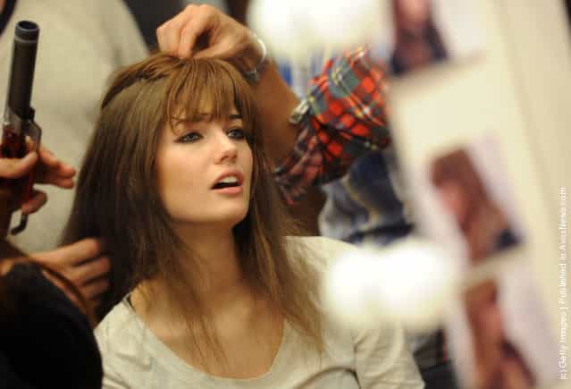 A model prepares prepares backstage at the Iceberg Autumn/Winter 2012/2013 fashion show as part of Milan Womenswear Fashion Week