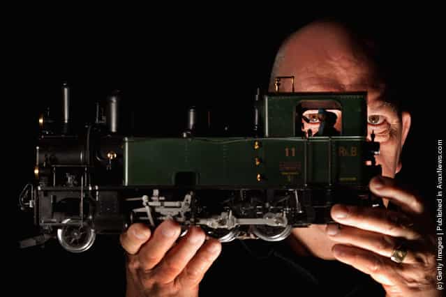 Fraser Nielson holds a G scale locomotive model as enthusiasts gather for the Rail Scotland exhibition