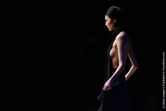 A model walks down the runway at the 13th China International Young Fashion Designers Contest during China Fashion Week