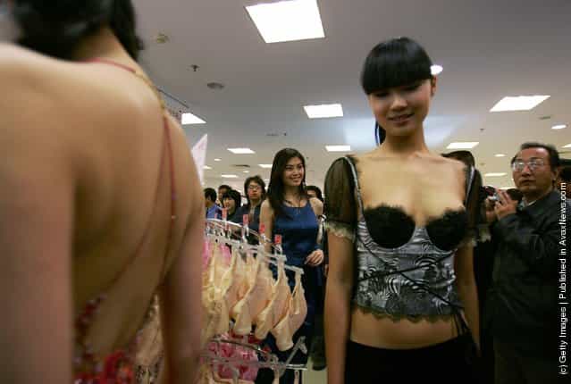 Models present creations to promote a Chinese lingerie brand during a fashion show