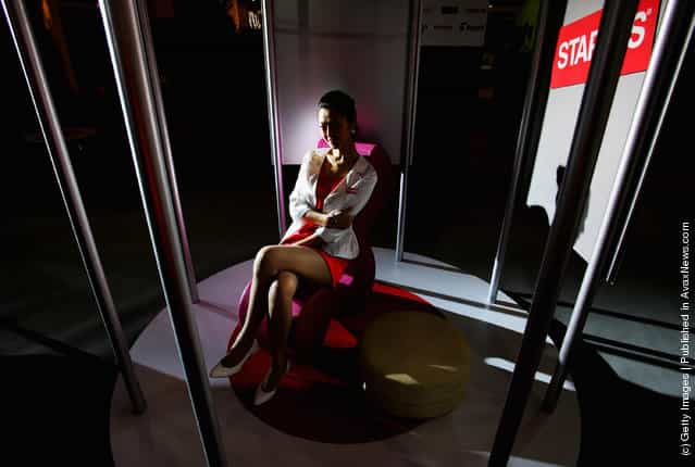 A Chinese model promotes a companys products at the 10th China International Furniture Exhibition