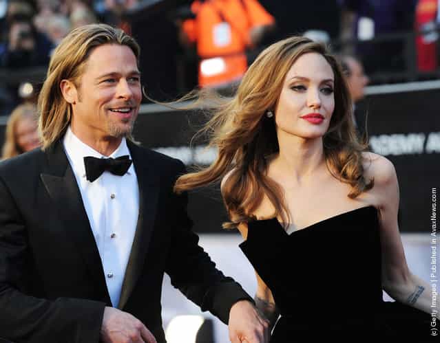 Actor Brad Pitt (L) and actress Angelina Jolie arrive at the 84th Annual Academy Awards held at the Hollywood & Highland Center