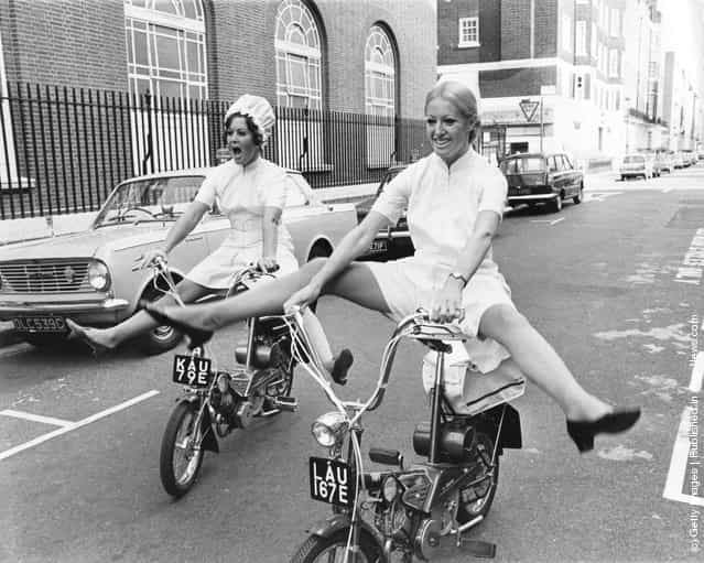 Models Glenda Warrington (left) and Caroline Whineray demonstrate the extra freedom and mobility afforded by the latest culotte dresses for nurses, 16th October 1967