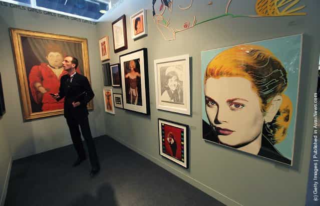 A visitor views works at the Chowaiki & Co. exhibitor booth at The Armory Show, New Yorks annual international art fair
