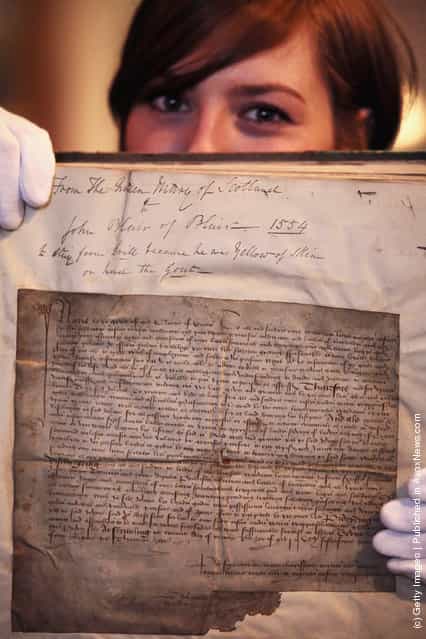 Charlotte Roirdan from Lyon & Turnbull views a letter written by Mary Queen of Scots