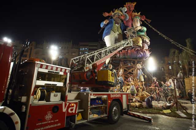 People prepare for the burning of the Ninot caricatures during the last day of the Fallas festival on March 19, 2012 in Valencia, Spain