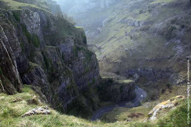 Motorists drive through the Cheddar Gorge