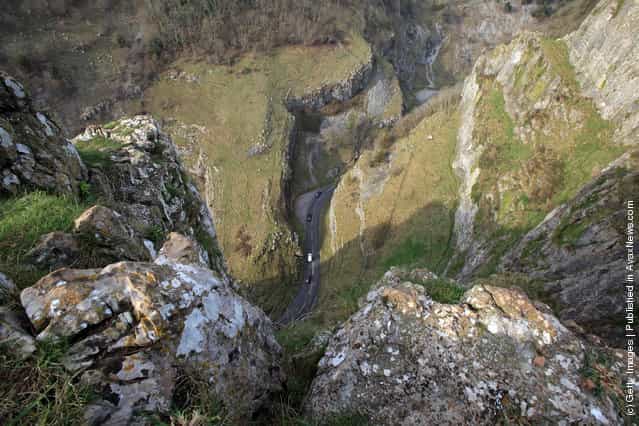 Motorists drive through the Cheddar Gorge