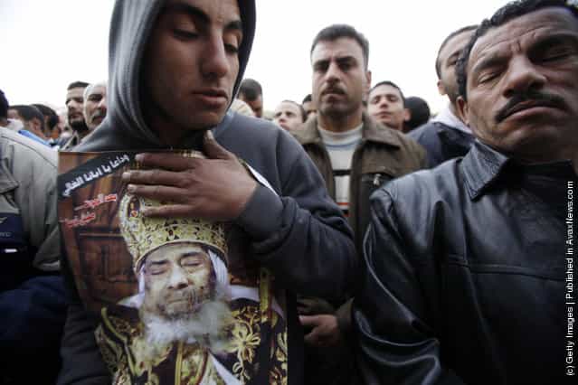 Egyptian Christians mourn during the funeral of Pope Shenouda III, the head of Egypt's Coptic Orthodox Church, at the Abassiya Cathedral at the funeral of Pope Shenouda III, the head of Egypt's Coptic Orthodox Church, near the Abassiya Cathedral